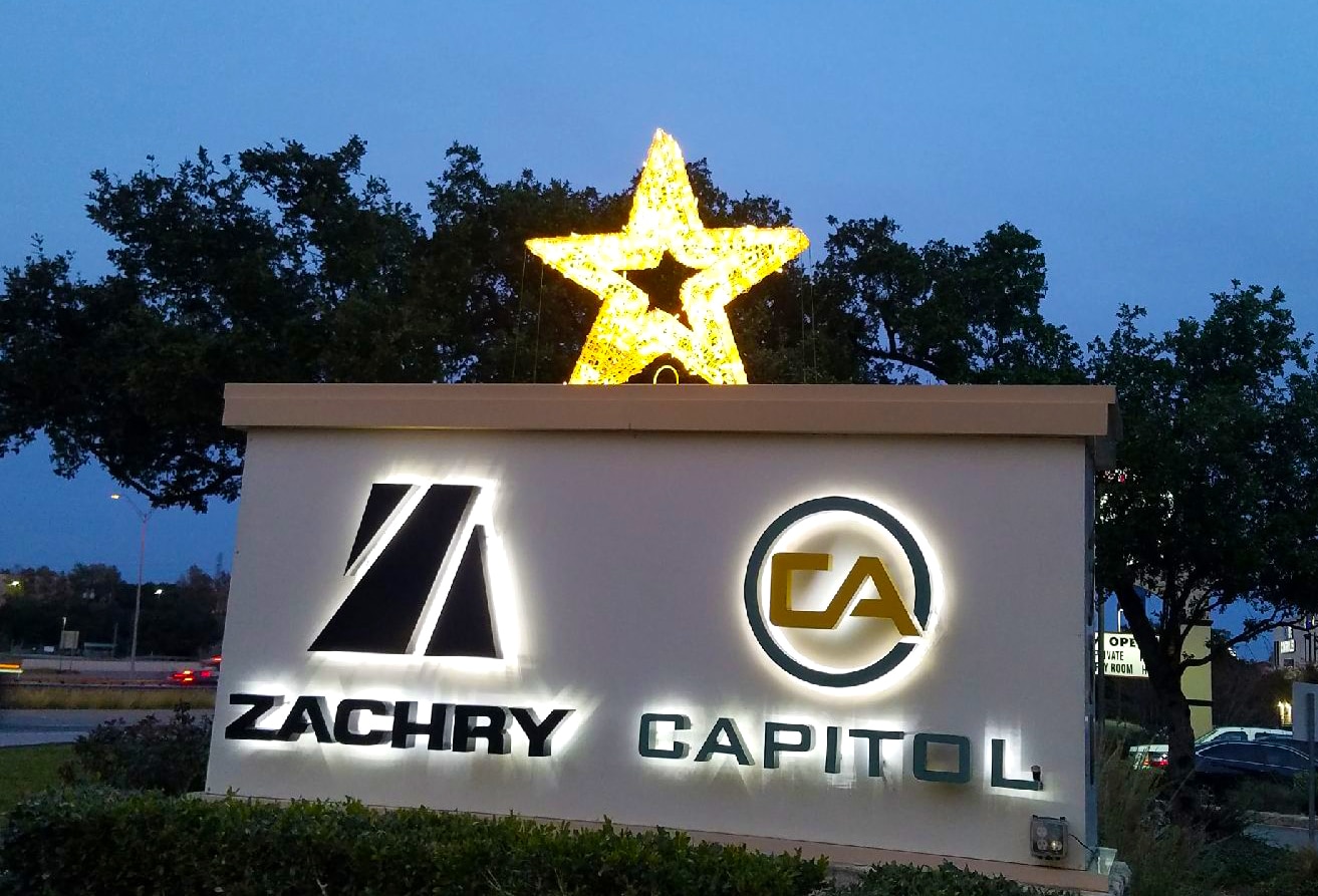 Star decoration on sign in front of office building.