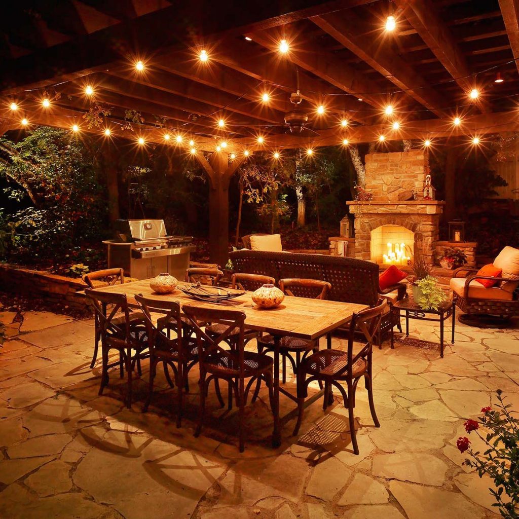 String lighting with large bulbs installed over back patio.